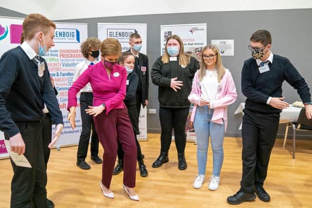 First Minister Nicola Sturgeon creates a TikTok video with pupils in Coatbridge earlier this year (Picture: Jane Barlow/Pool/AFP via Getty Images)