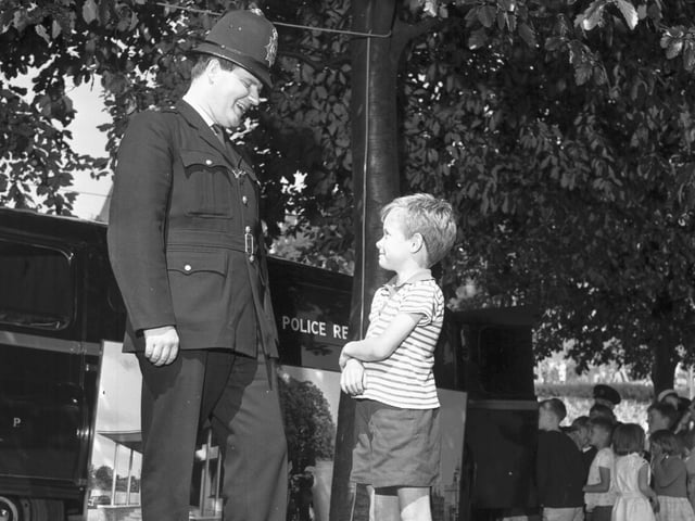 In the 1960s the police would hold regular recruitment drives on Princes Street and in Princes Street Gardens. Little Angus McPherson is pictured talking to a London Metropolitan Police officer at such an event.