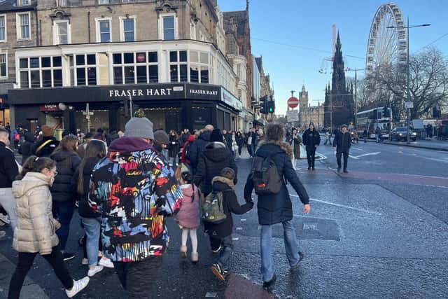 Princes Street, once Edinburgh's key shopping thoroughfare but now punctuated with several empty premises, was busy on Boxing Day