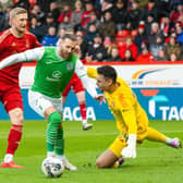 Hibs; Martin Boyle rounds Aberdeen's Kelle Roos before making it 1-0 at Pittodrie.