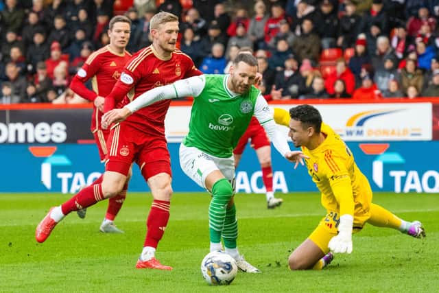 Hibs; Martin Boyle rounds Aberdeen's Kelle Roos before making it 1-0 at Pittodrie.