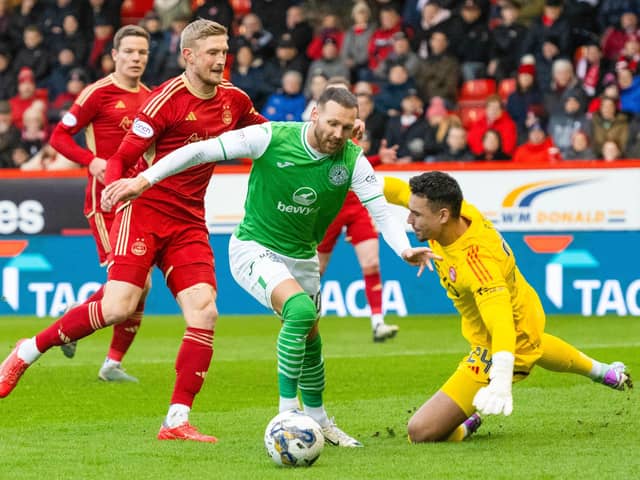 Hibs; Martin Boyle rounds Aberdeen's Kelle Roos before making it 1-0 at Pittodrie.