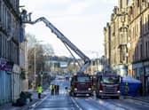 Emergency services at the scene at the New County Hotel in Perth where three people have died following a fire.