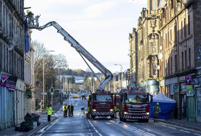 Emergency services at the scene at the New County Hotel in Perth where three people have died following a fire.