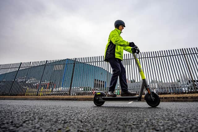 E-scooters can be used legally only on private land with the owner's consent, such as this office car park. Picture: John Devlin