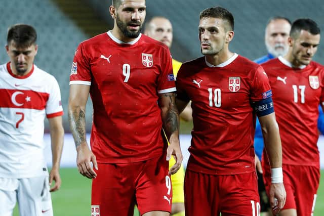 Dusan Tadic chats with Aleksandar Mitrovic (Photo by Srdjan Stevanovic/Getty Images)