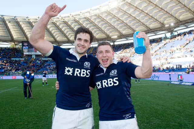 Alex Dunbar, who scored two tries, and Duncan Weir, who converted the late, late winning drop goal, celebrate the win over Italy in Rome in 2014. Picture: Craig Watson/SNS