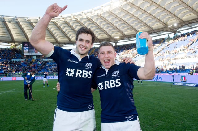 Alex Dunbar, who scored two tries, and Duncan Weir, who converted the late, late winning drop goal, celebrate the win over Italy in Rome in 2014. Picture: Craig Watson/SNS