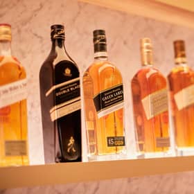 FTSE-100 spirits giant Diageo has a vast portfolio that includes Johnnie Walker whisky, pictured, Guinness stout and Smirnoff vodka.