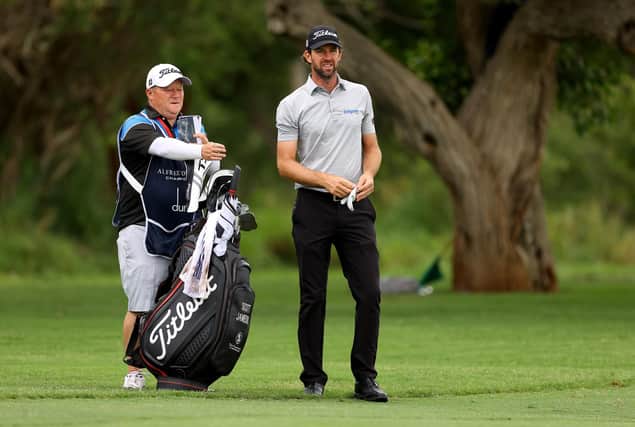 Scott Jamieson talks tactics with caddie Ritchie Blair on the first hole during the second round of the Alfred Dunhill Championship at Leopard Creek Country Golf Club. Picture: Richard Heathcote/Getty Images