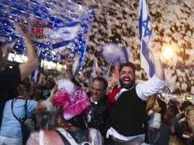 Israelis celebrate the swearing in of the new government in Tel Aviv on Sunday