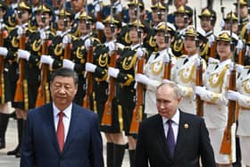 Vladimir Putin and Xi Jinping attend an official welcoming ceremony in Tiananmen Square in Beijing on Thursday (Picture: Sergei Bobylyov/pool/AFP via Getty Images)