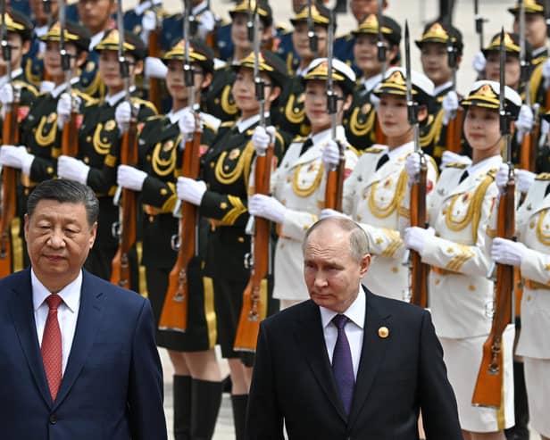 Vladimir Putin and Xi Jinping attend an official welcoming ceremony in Tiananmen Square in Beijing on Thursday (Picture: Sergei Bobylyov/pool/AFP via Getty Images)