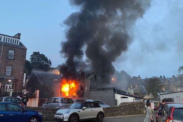 Flames engulfed the building last night (Photo: @gavmacn).