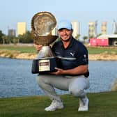Ewen Ferguson showsoff the trophy after winning the Commercial Bank Qatar Masters at Doha Golf Club on Sunday. Picture: Stuart Franklin/Getty Images.