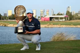 Ewen Ferguson showsoff the trophy after winning the Commercial Bank Qatar Masters at Doha Golf Club on Sunday. Picture: Stuart Franklin/Getty Images.