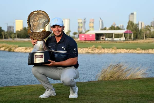 Ewen Ferguson showsoff the trophy after winning the Commercial Bank Qatar Masters at Doha Golf Club on Sunday. Picture: Stuart Franklin/Getty Images.