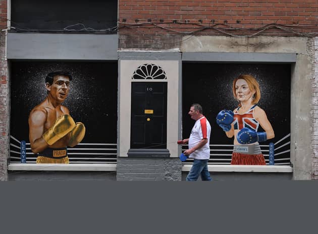A mural in Belfast depicts Conservative party leadership hopefuls Rishi Sunak and Liz Truss in boxing gear and the door to 10 Downing Street (Picture: Charles McQuillan/Getty Images)