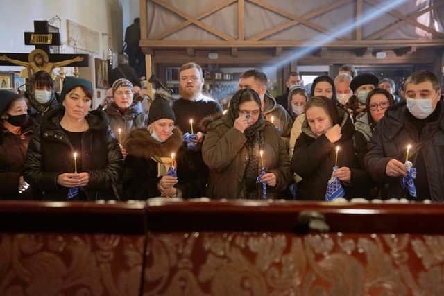 Family and friends of Captain Anton Olegovich Sidorov attend his funeral in Kyiv, Ukraine, on Tuesday after he was killed in a wave of shelling by pro-Russian rebels (Picture: Pierre Crom/Getty Images)