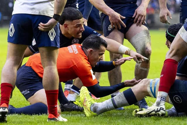 Referee Nic Berry checks to see if the ball is grounded as Scotland's Sam Skinner attempts to score what would have been a match-winning try against France in the Six Nations match at Murrayfield.