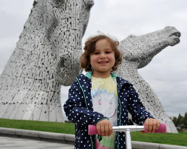 Five year old leukaemia patient Mila Sneddon scooting around The Kelpies to raise money for Blood Cancer UK. Picture: Michael Gillen