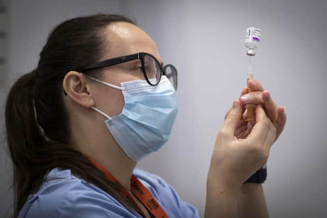 A member of the vaccine team prepares a syringe with a dose of the AstraZeneca/Oxford Covid-19 vaccine at an NHS Scotland vaccination centre set up at the Edinburgh International Conference Centre. Picture: Jane Barlow/POOL/AFP via Getty Images