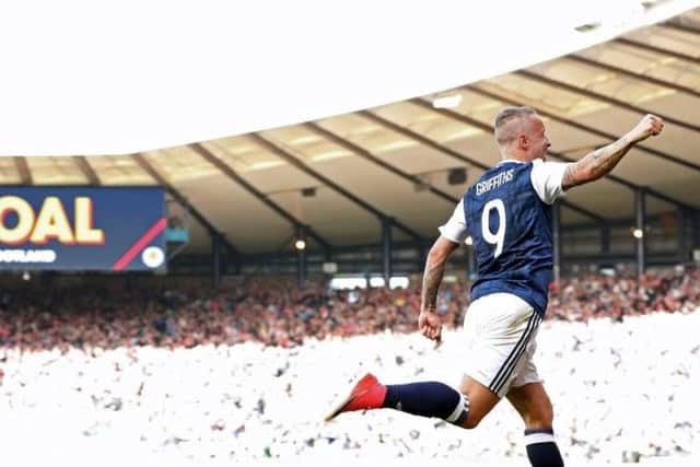 Leigh Griffiths wheels away after his memorable double strike against Englnand in 2017.