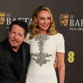 Canadian actor Michael J Fox (left) and his wife US actress Tracy Pollan pose on the red carpet upon arrival at the Bafta British Academy Film Awards at the Royal Festival Hall in London. Picture: Adrian Dennis/AFP via Getty Images