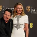Canadian actor Michael J Fox (left) and his wife US actress Tracy Pollan pose on the red carpet upon arrival at the Bafta British Academy Film Awards at the Royal Festival Hall in London. Picture: Adrian Dennis/AFP via Getty Images