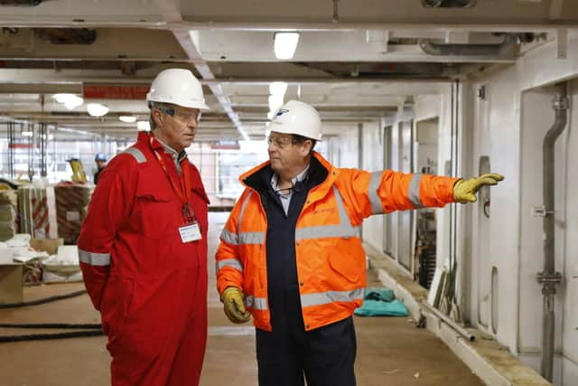 Holyrood net zero, energy and transport committee convener Edward Mountain, left, being shown round Glen Sannox by Ferguson Marine chief executive David Tydeman on February 23. (Photo by Andrew Cowan/Scottish Parliament)