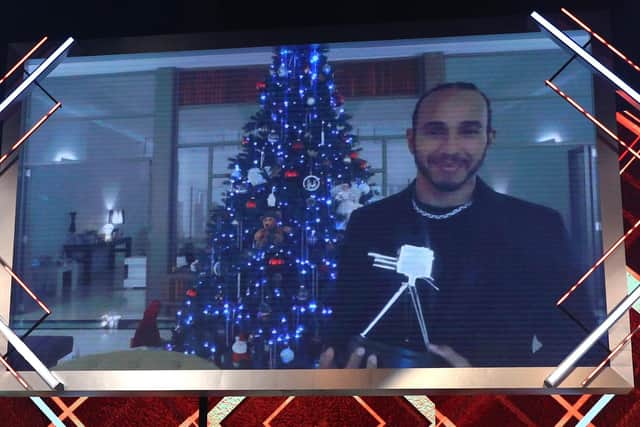 Lewis Hamilton with the BBC Sports Personality of the Year Award. Picture: Peter Byrne/PA Wire