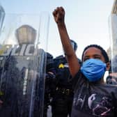 A young boy raises his fist for a photo during a demonstration in Atlanta, Georgia (Photo: Elijah Nouvelage/Getty Images)