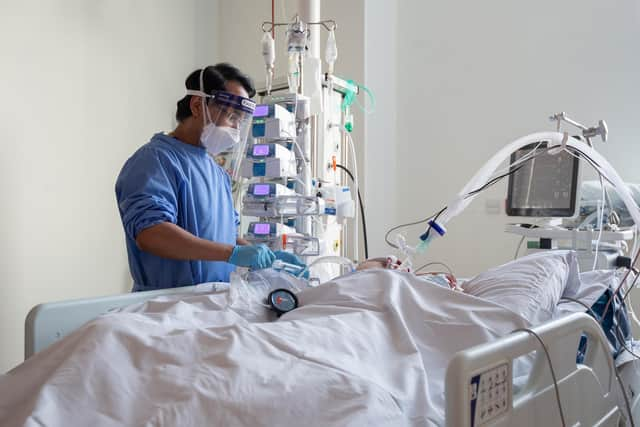 A nurse checks checks on a patient suffering with Covid-19 on the critical care unit. Picture: PA Media