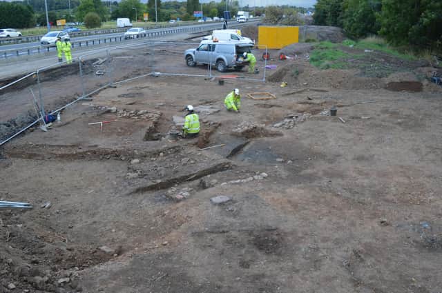 Archaeologists at the site of the "remarkable" discovery of a lost village right next to the hard shoulder of the M74. PIC: GUARD Archaeology.