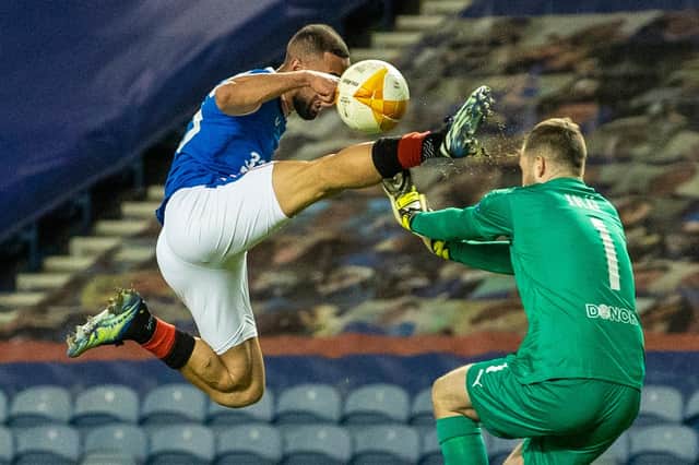 Rangers striker Kemar Roofe catches Slavia Prague goalkeeper Ondrej Kolar in the face with his boot before receiving a red card during the Europa League match at Ibrox on March 18 (Photo by Alan Harvey / SNS Group)