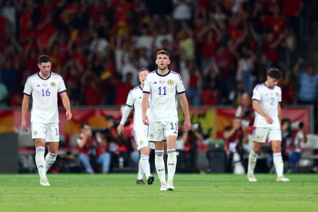 Scotland's Ryan Christie and team-mates look dejected after Alvaro Morata opens the scoring for Spain. (Photo by Fran Santiago/Getty Images)
