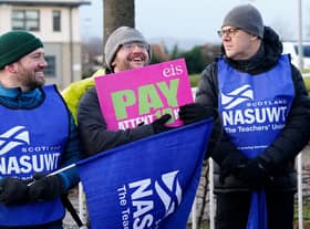 Members of the EIS and NASUWT unions, join the picket line at Craigmount High School in Edinburgh. Secondary schools around Scotland are shut as members of the EIS and SSTA unions take strike action in a dispute over pay. Picture date: Wednesday January 11, 2023.