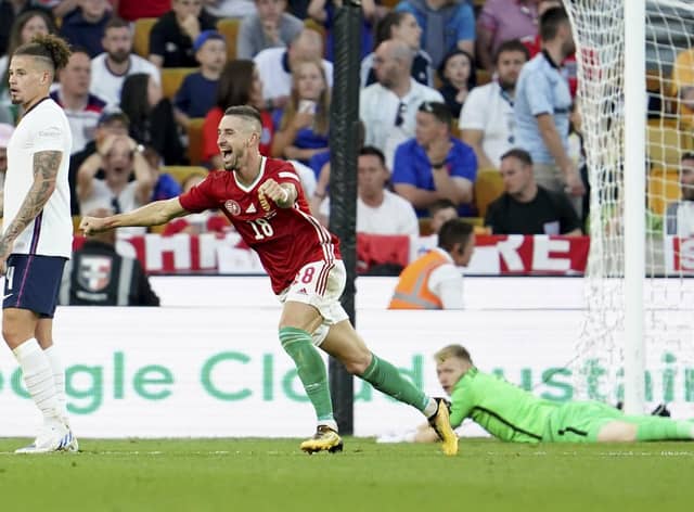 Hungary's Zsolt Nagy, center, jubilates after scoring his sides third goal against England.