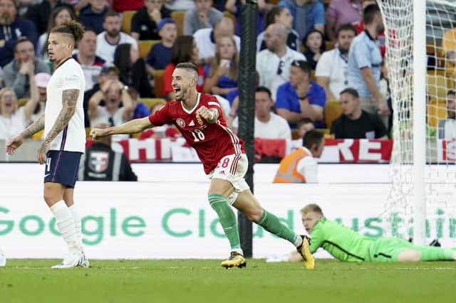 Hungary's Zsolt Nagy, center, jubilates after scoring his sides third goal against England.
