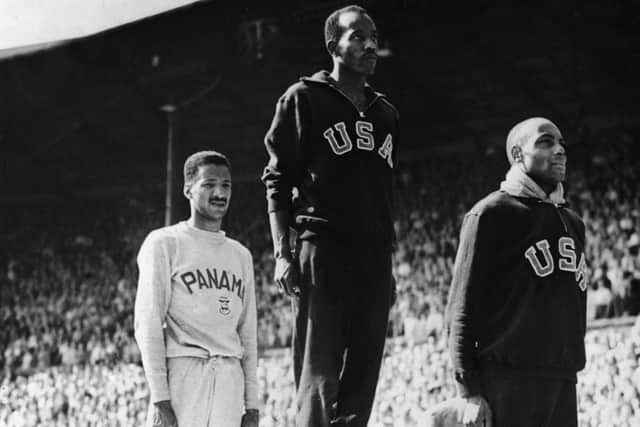 Barney Ewell, right, on the podium after his second place finish in the 100m at the 1948 Olympics in London. Fellow American Harrison Dillard, centre, won gold while Lloyd La Beach of Panama, left, took bronze.