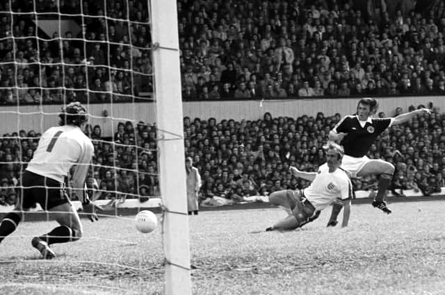 Kenny Dalglish slides in the winning goal through keeper Ray Clemence's legs for Scotland against England at Hampden in May 1976. Picture: Allan Milligan