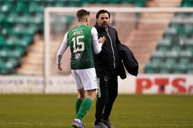 Hibernian's Kevin Nisbet greets Cove Rangers manager Paul Hartley after the final whistle (Picture: Andrew Milligan/PA Wire)