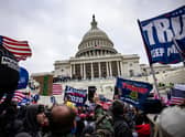 Donald Trump's supporters storm the US Capitol in an attempt to stop the ratification of Joe Biden's election as US president (Picture: Samuel Corum/Getty Images)