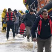 A group of people thought to be migrants are brought in to Dungeness, Kent, from the RNLI Dungeness Lifeboat, following a small boat incident in the Channel. Picture: PA