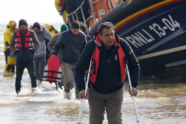 A group of people thought to be migrants are brought in to Dungeness, Kent, from the RNLI Dungeness Lifeboat, following a small boat incident in the Channel. Picture: PA