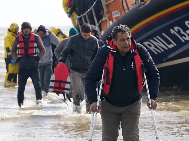 A group of people thought to be migrants are brought in to Dungeness, Kent, from the RNLI Dungeness Lifeboat, following a small boat incident in the Channel. Picture: PA