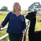 Helen Macdonald with Geronimo the alpaca at Shepherds Close Farm in Wooton Under Edge, Gloucestershire, after losing a last-ditch High Court bid to save him.