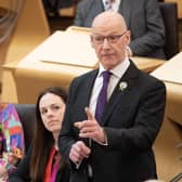 John Swinney with his deputy Kate Forbes next to him at his first FMQS (Photo by Lesley Martin/PA Wire)