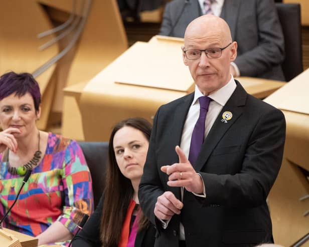 John Swinney with his deputy Kate Forbes next to him at his first FMQS (Photo by Lesley Martin/PA Wire)