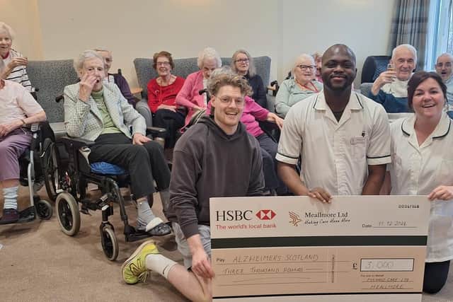 Fit Baw coach Ben Fry, Oluwaseun Owoeye (David) and Laura McCulley with Mearns House residents